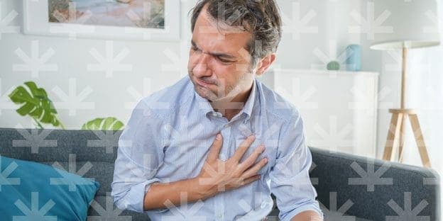 a man holding his chest and in pain